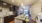 Spacious and well lit kitchen with wood flooring and stainless steel appliances